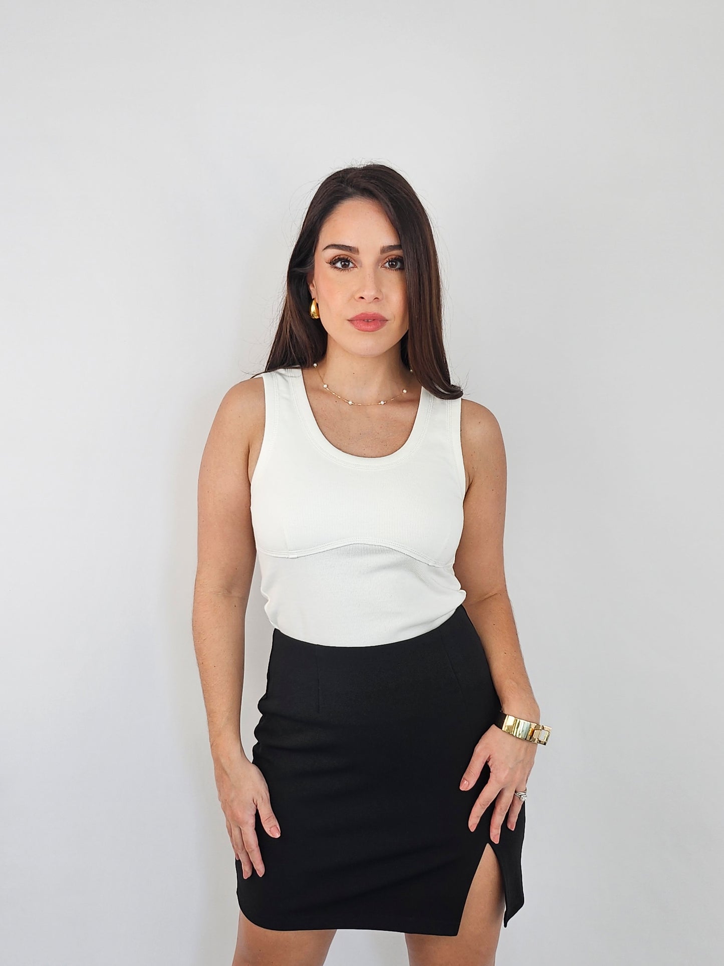 This ivory white tank is more thank just a tank top. It has a corset look to it allowing this piece to be great with you jeans, pants or skirts.