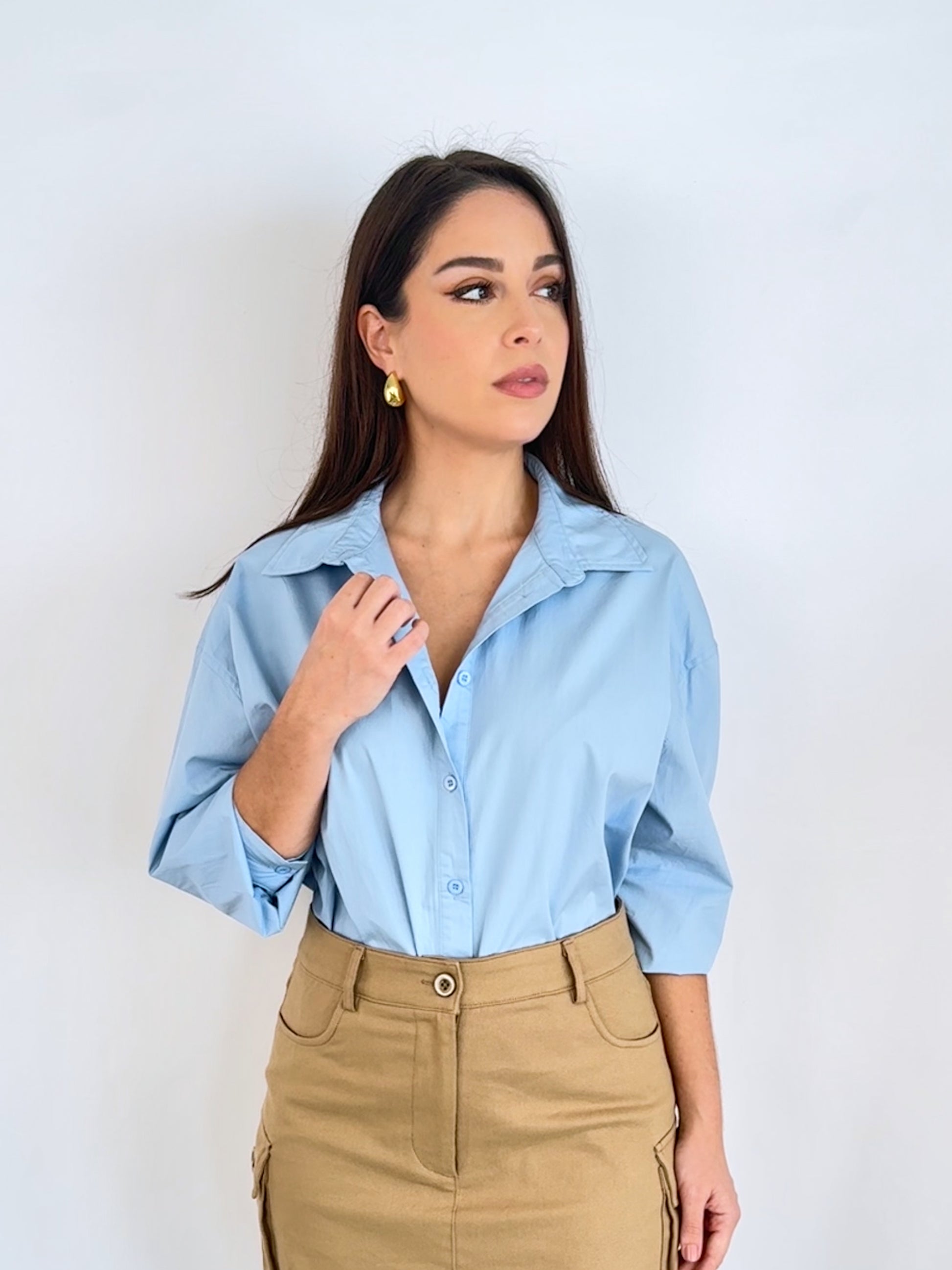 Showcasing the blue button up shirt and how it can be paired with a skirt for more of a casual look or trousers or a pencil skirt for more of a workwear piece.