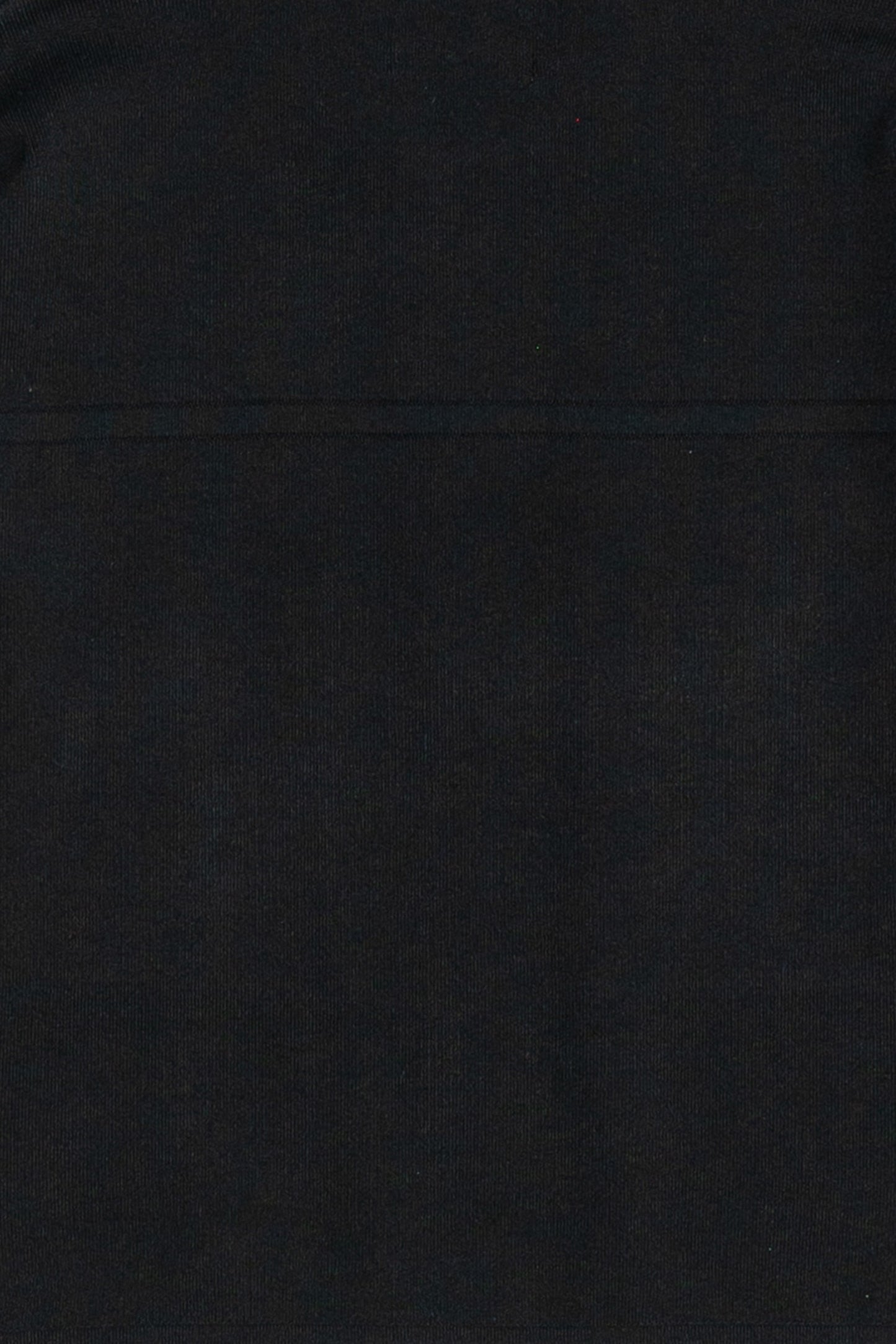 Up close photo of the fabric as its made of a thick material making this a staple piece jacket that you can wear with pants, shorts, a skirt or to the gym.