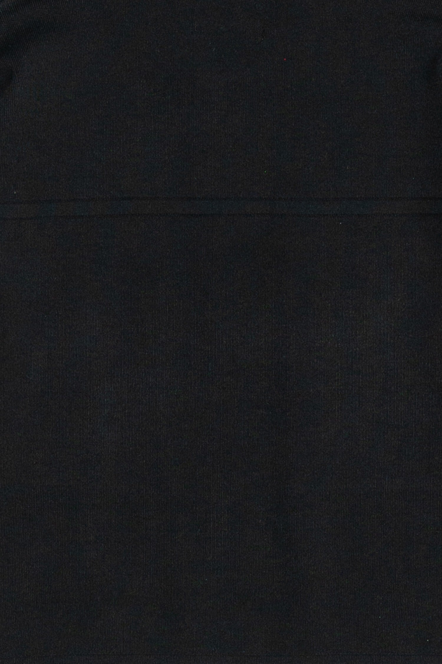 Up close photo of the fabric as its made of a thick material making this a staple piece jacket that you can wear with pants, shorts, a skirt or to the gym.