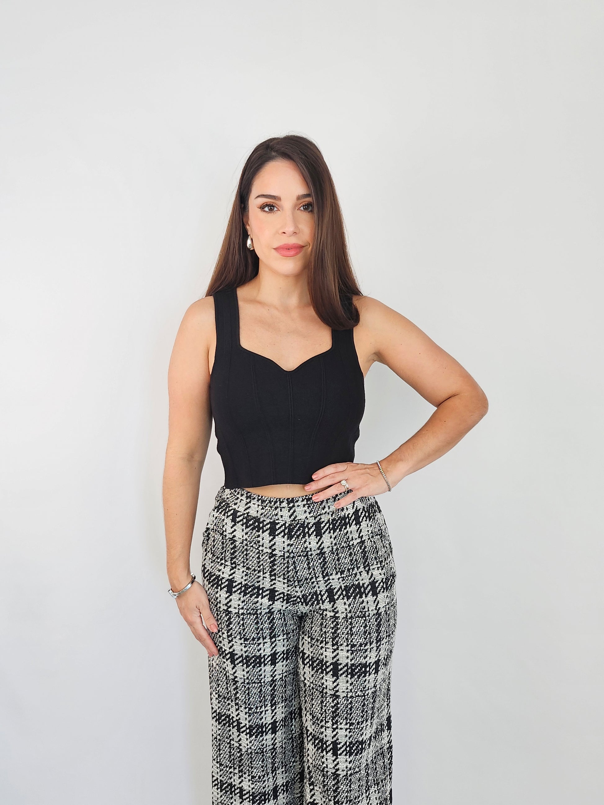 Black knitted crop top perfect to pair with any item in your wardrobe making this a staple piece to have.