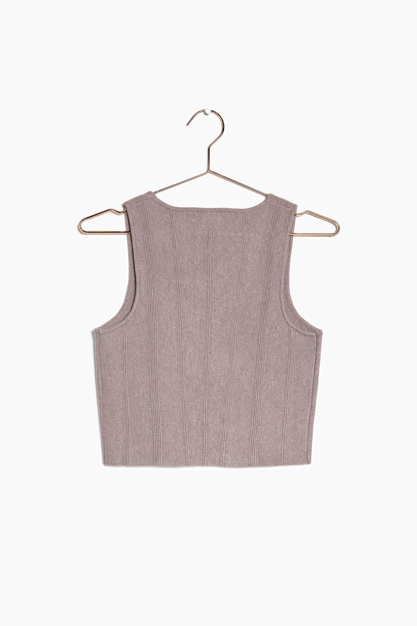 The back of the brown knit crop top and the detail on the top.