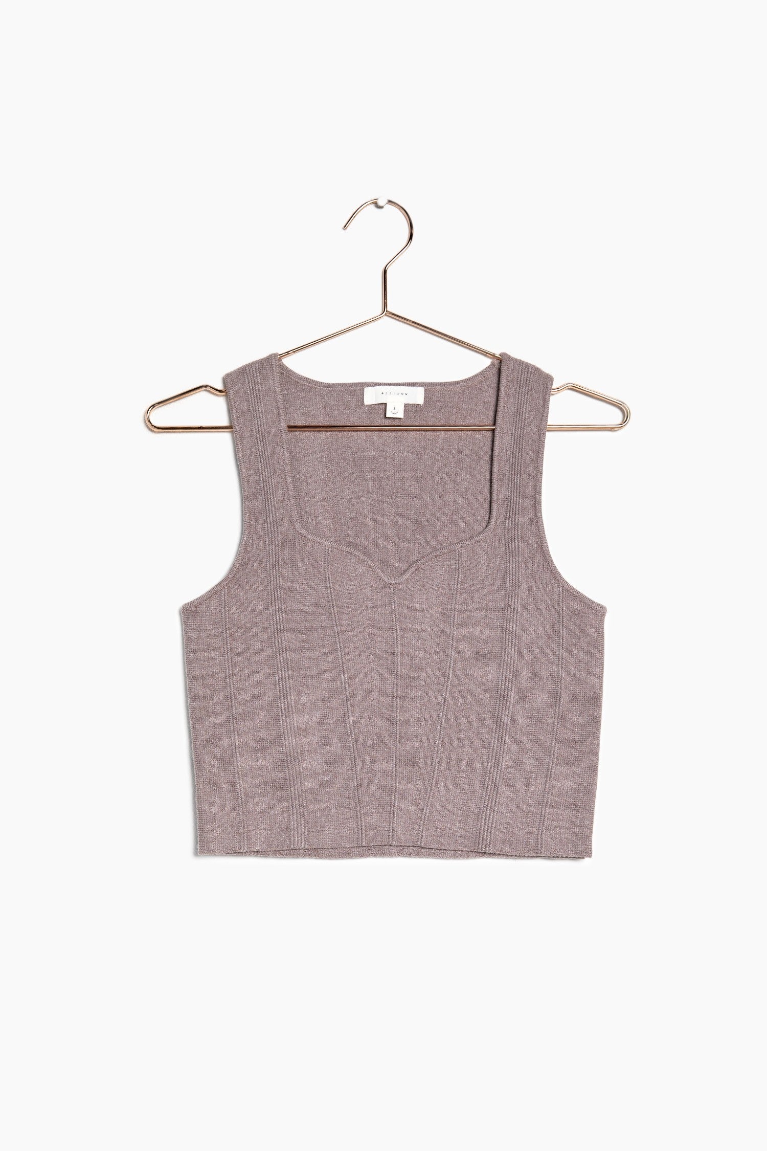 Close up of the brown knit crop top and the beautiful sweetheart neckline that it showcases.