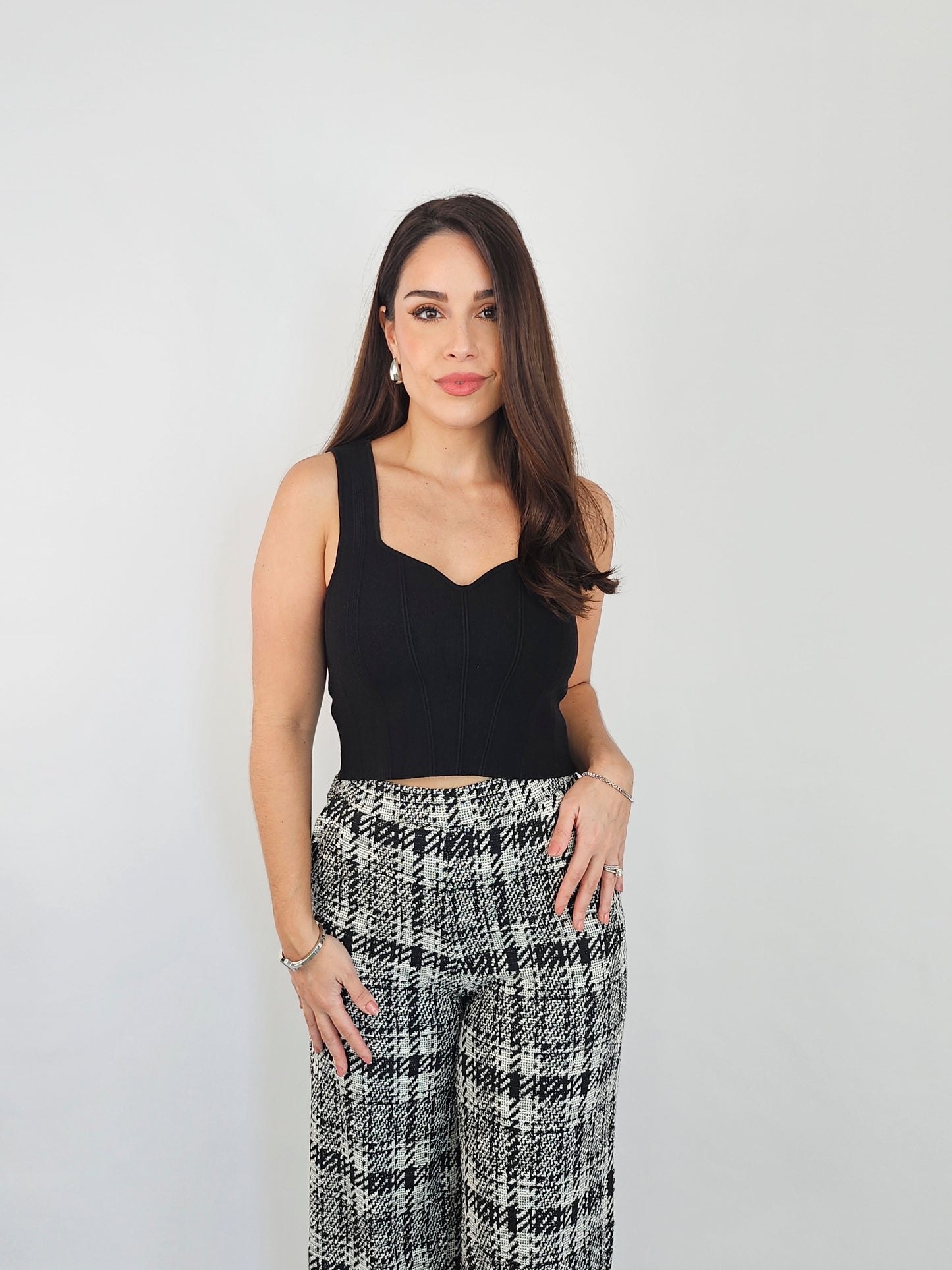 Black knit crop top perfect to pair with trousers, an a-line skirt or shorts. You can make this top versatile by pairing it for work or for an everyday look