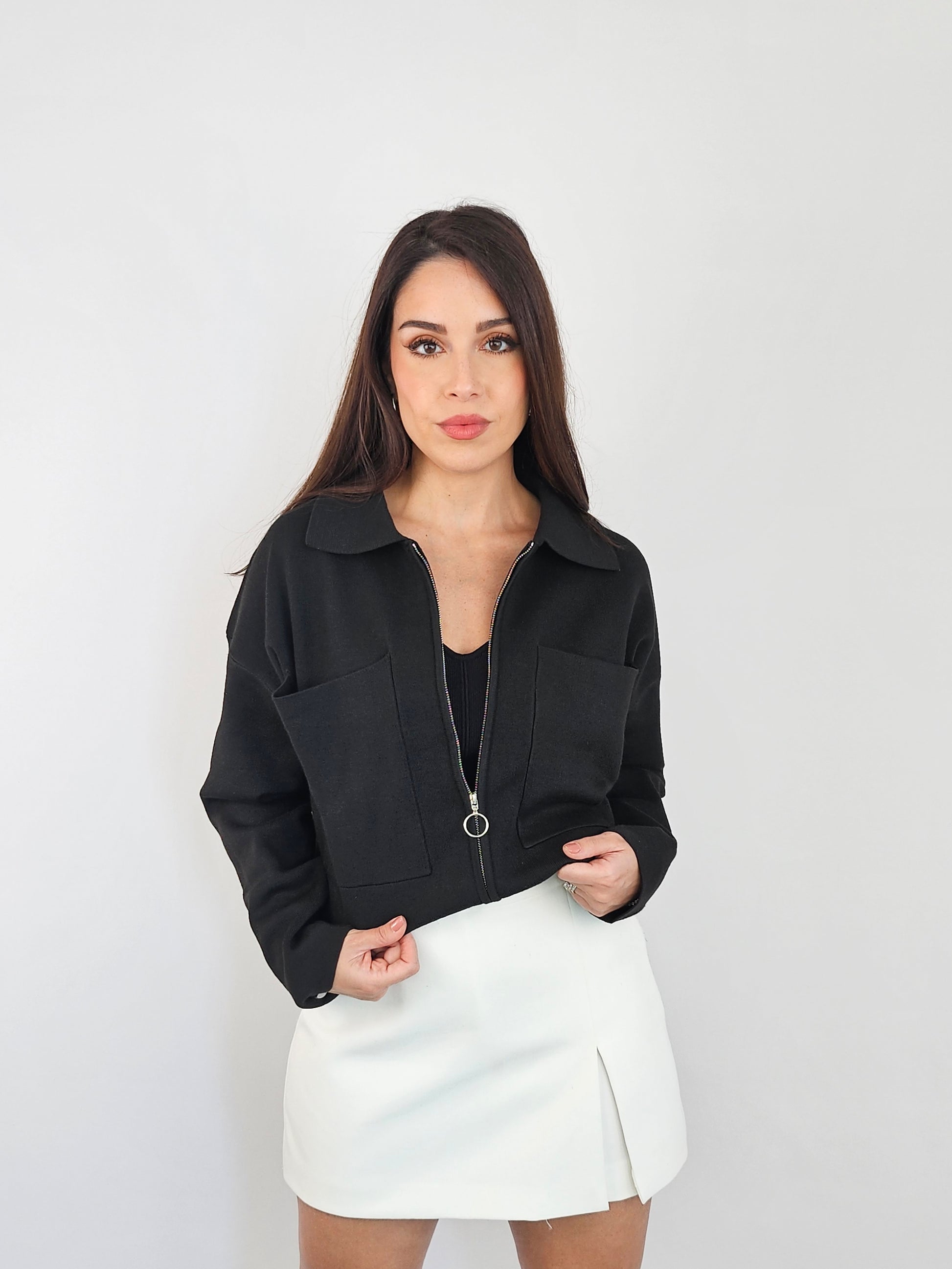 Black zip up jacket that can be worn in two ways crop or regular length. 
