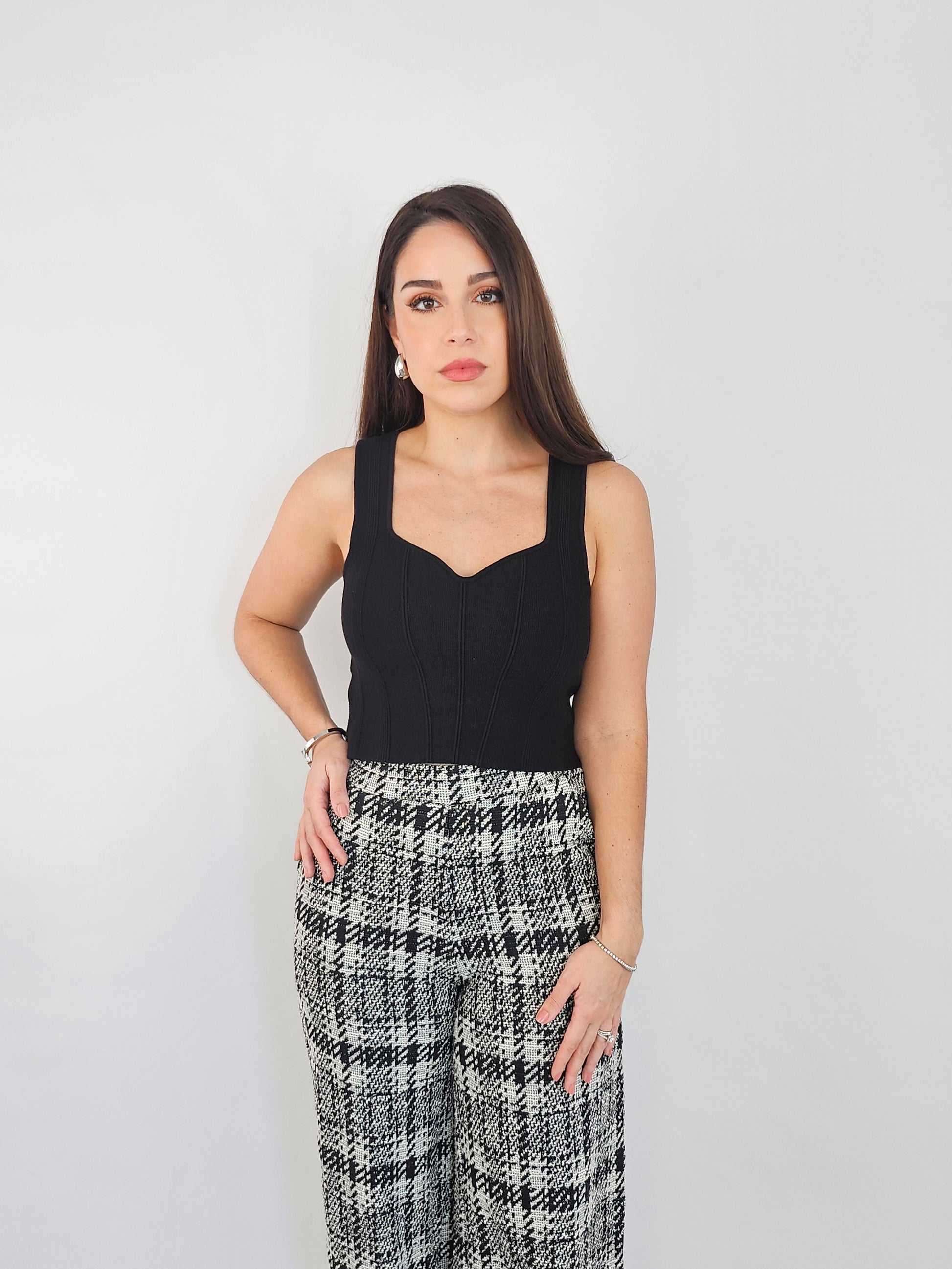 Black knitted crop top to make a staple in your closet that you can wear with any item. 