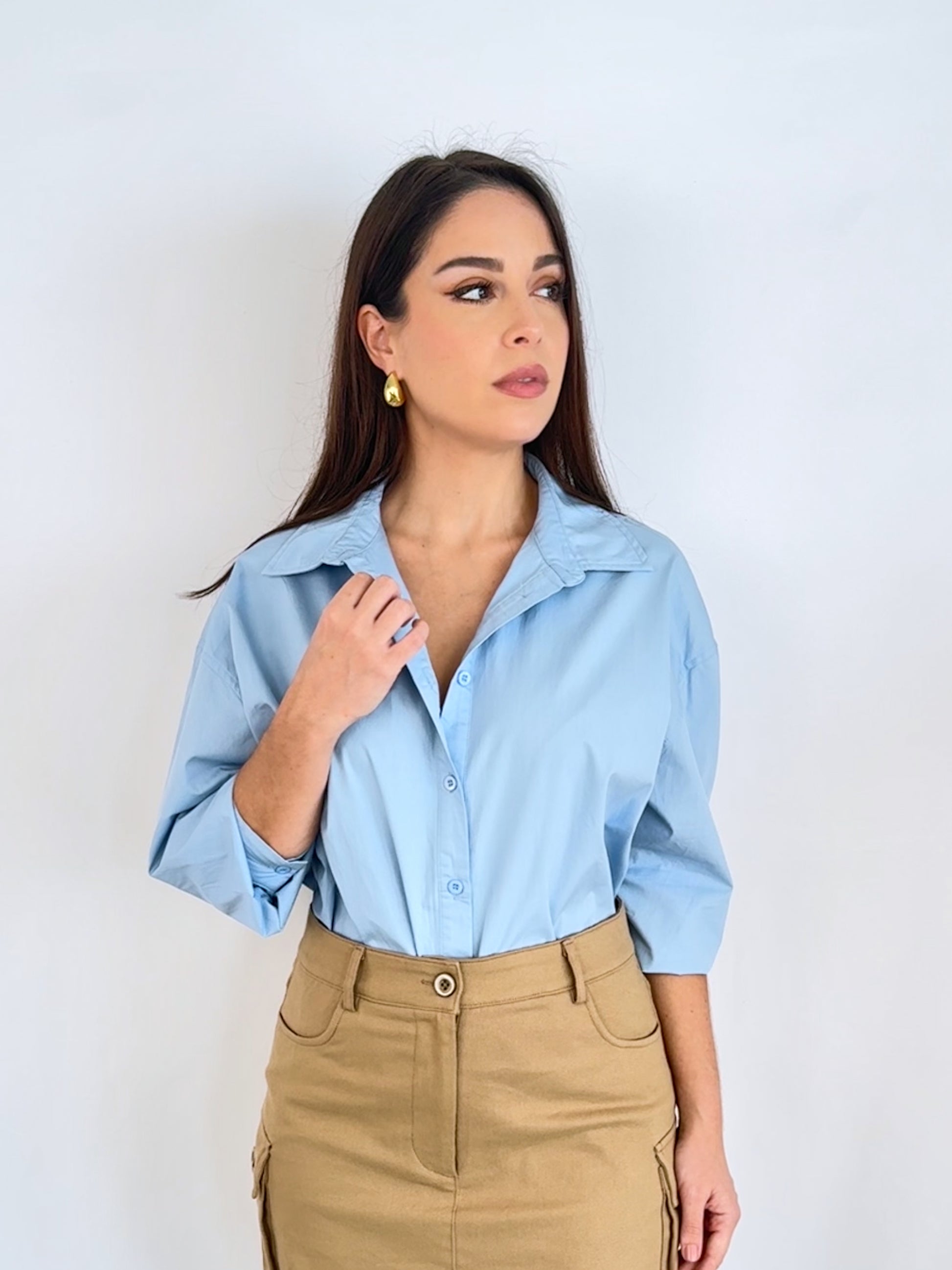 Showcasing the blue button up shirt and how it can be paired with a skirt for more of a casual look or trousers or a pencil skirt for more of a workwear piece. 