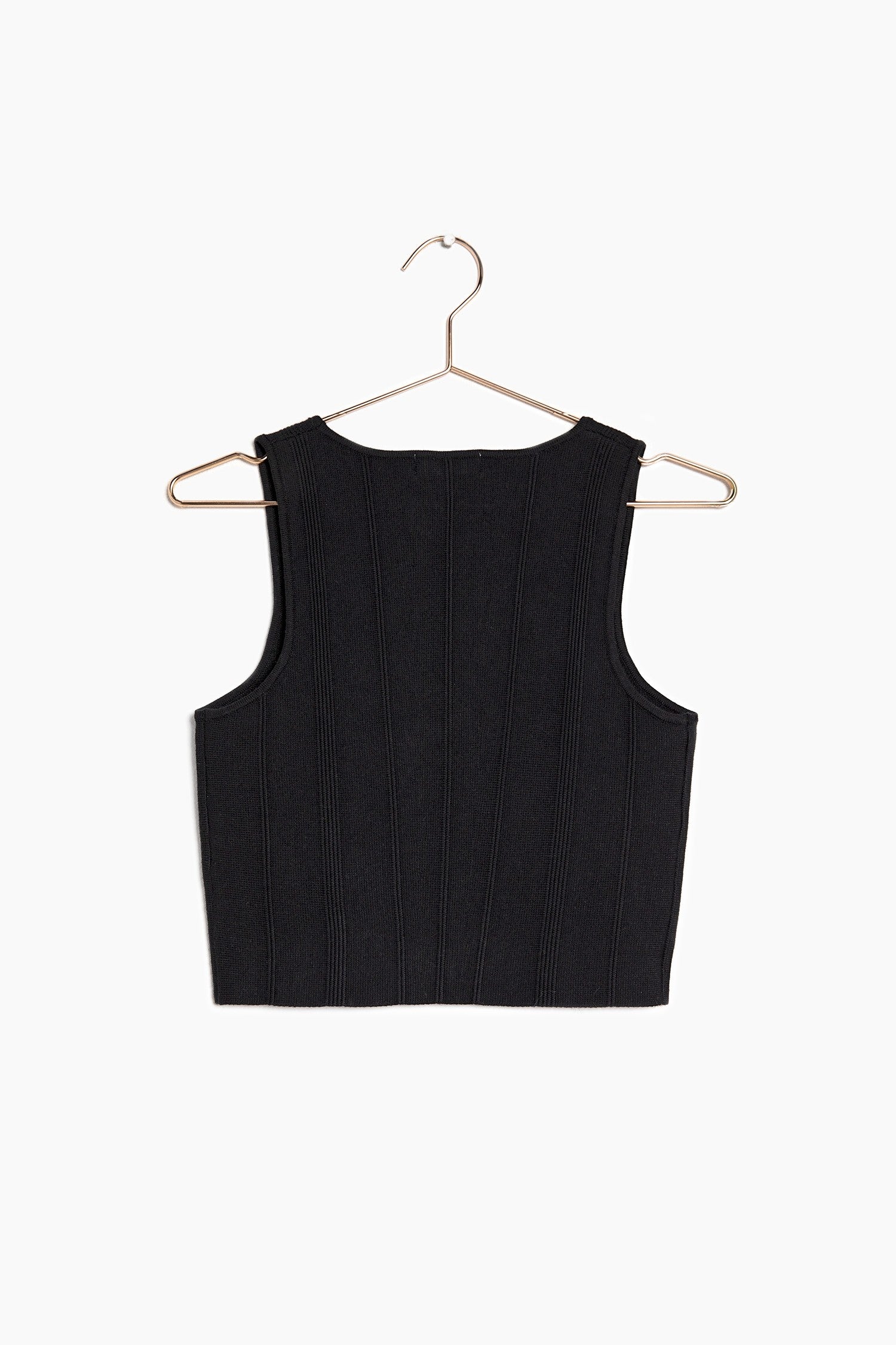 Back of the black crop top knit to show case how it look on a hanger and the detailing of the top.