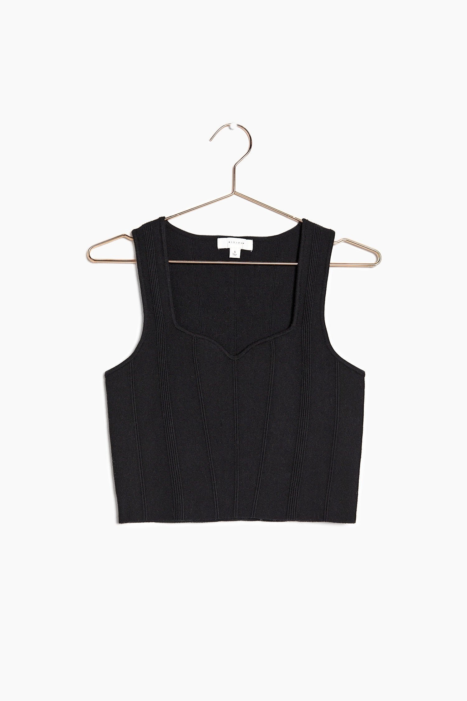 Front of the knit top on a hanger showcasing the beautiful sweetheart neckline
